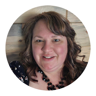 photo of shawntel gruba the ceo of iron range tykes learning center. she has long brown hair and wears a black top and necklace