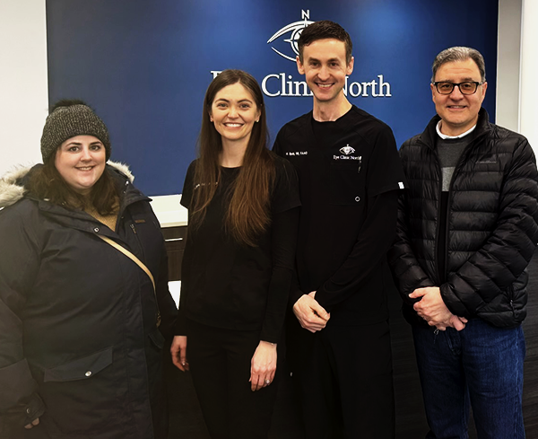 amanda and michael from the northland foundation stand on either side of hannah and matt sipola during the eye clinic north grand opening